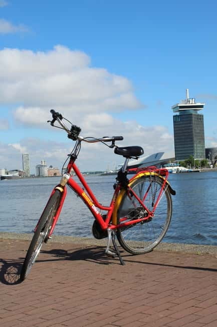 Amsterdam:: Bike Rental with Free Self-Guided Tour - Crossing the ferry to the Dutch countryside