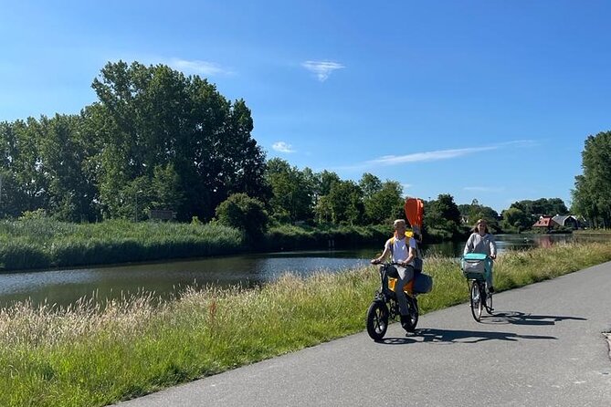 Amsterdam Countryside Bike and Kayak Tour - Riding through the countryside and across by cable ferry