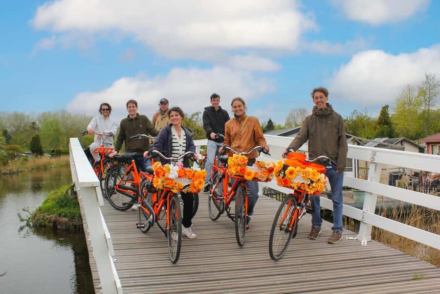 Amsterdam: E-Bike, Cheese, Windmill & Countryside Tour - Riding Nieuwendammerdijk beside the IJ River