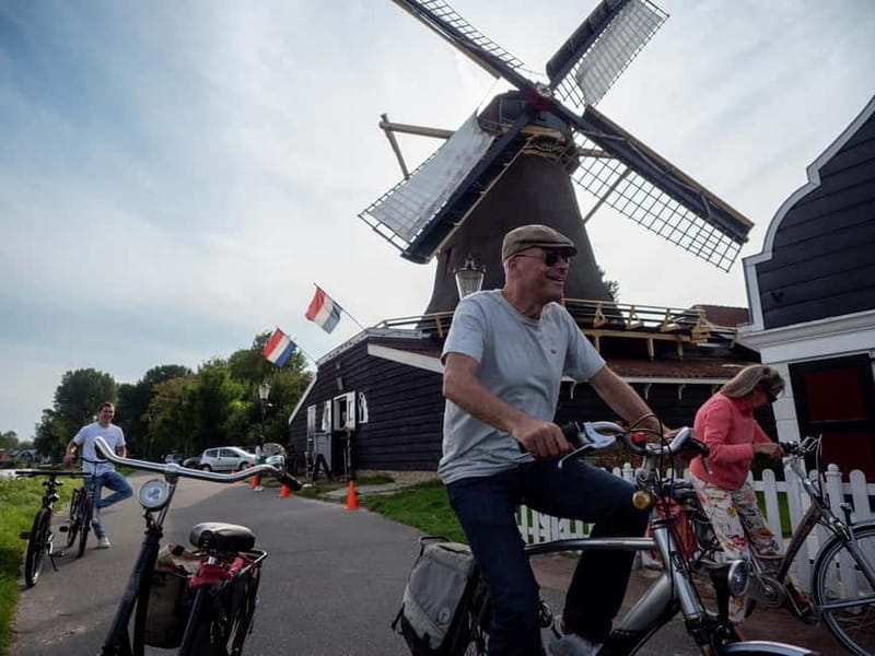 Amsterdam: Leisurely Windmill & Countryside Bike Ride - Leaving Amsterdam by ferry and bike