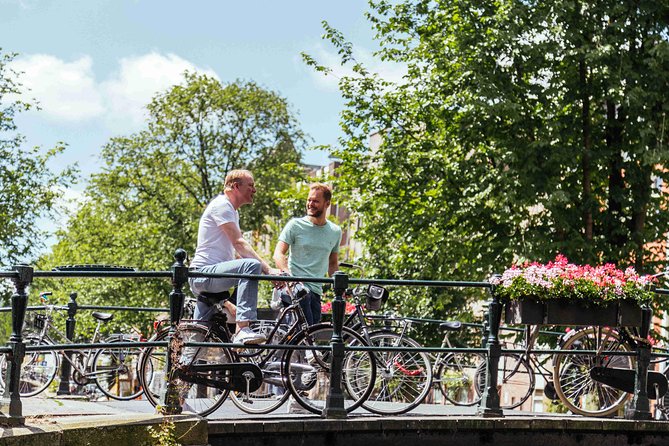 Amsterdam PRIVATE Bike Tour With Locals: Bike & Local Snack Included - Westerkerk and the Canal Belt