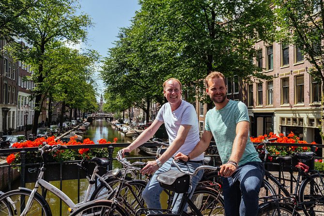 Amsterdam PRIVATE Bike Tour With Locals: Bike & Local Snack Included - Jordaan Streets, Markets, and Small Detours