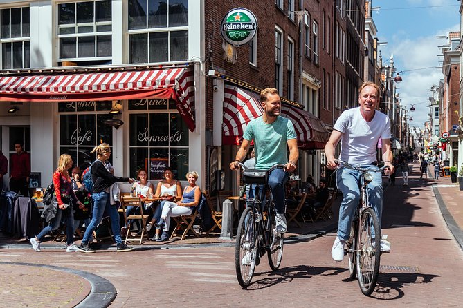 Amsterdam PRIVATE Bike Tour With Locals: Bike & Local Snack Included - Magere Brug and the Amstel