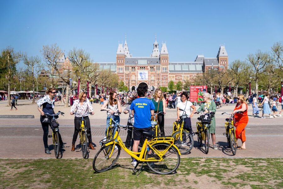 Amsterdam: Relaxed City Highlights Guided Bike Tour - Starting near Nieuwezijds Kolk and the old canal belt