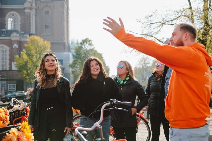 Amsterdam: Top Highlights Guided Bike Tour - Passing the Red Light District and pausing at Leidse Square