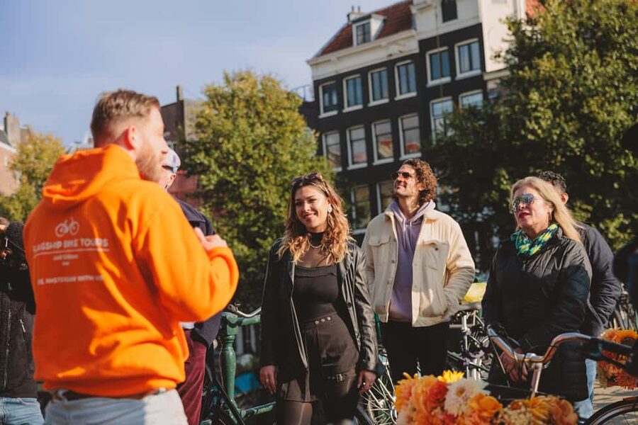 Amsterdam: Top Highlights Guided Bike Tour - Dam Square brings the loop back to Central Station