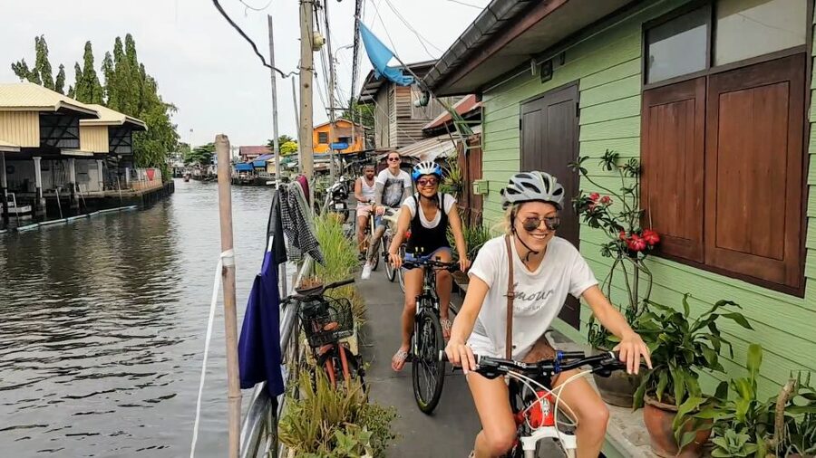 Bangkok: Bike and Canal Boat Tour with Lunch - What the guides add to the experience