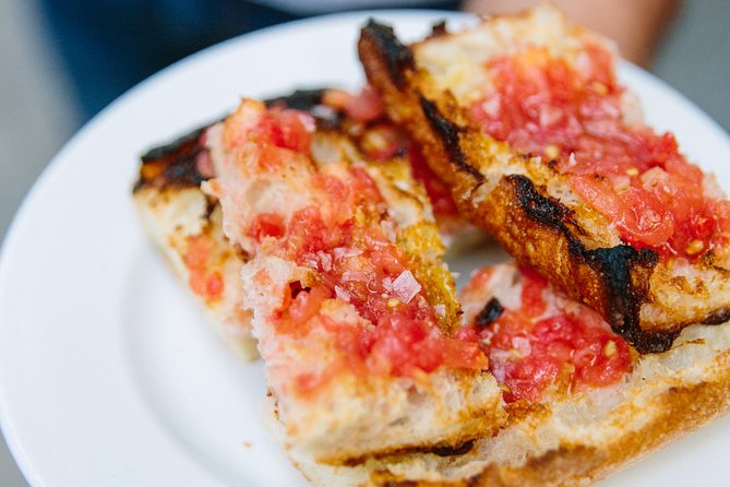 Barcelona Night Bike Tour with Local Tapas and Cava Stop - Riding through Port Vell and past Columbus