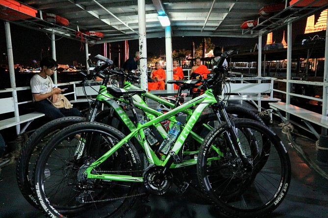 Bike Bangkok at Night with Thai Dinner - Wat Arun under the evening lights