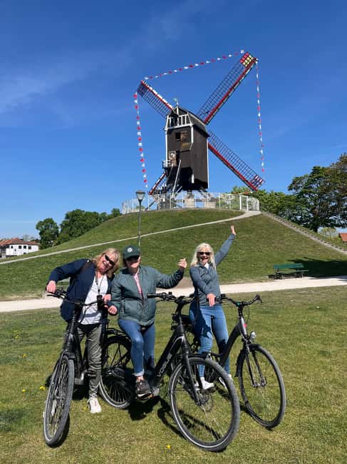 Bruges: Guided Bike Tour with a Local to Sights & Secrets - Market Square, the Belfry, and Bruges’ famous face