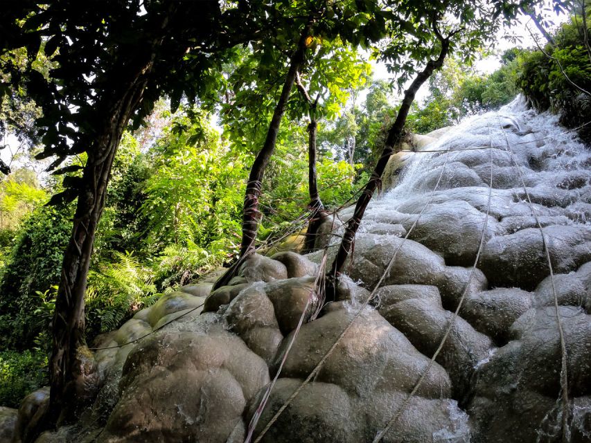 Chiang Mai: Boat Ride and Cycling Tour to Sticky Waterfall - Arriving at Sticky Waterfall