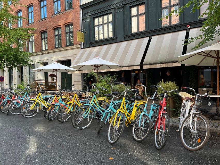 Copenhagen: City Highlights Guided Bike Tour - Gardens, cobbled streets, and photo breaks
