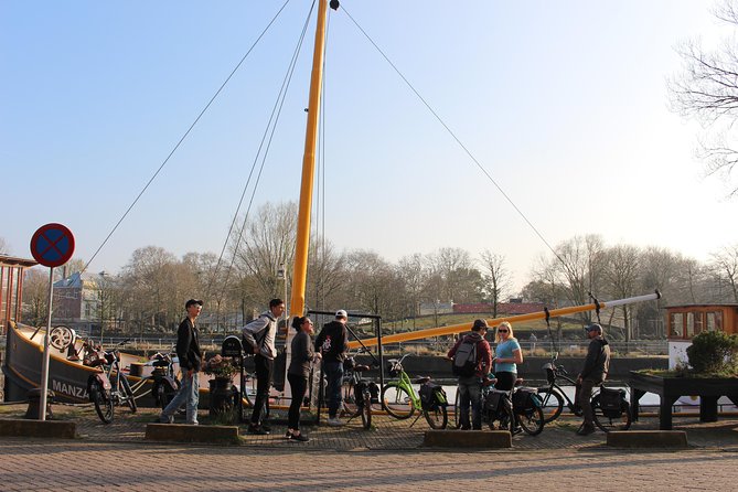 E-Bike Tour, Amsterdam's Highlights and Hidden Gems - Magere Brug and houseboats along the Amstel