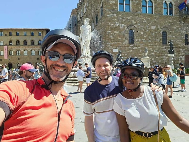 Florence: Untold Small Group Bike Tour - Piazza della Signoria, Medici power, and a wine-window pause