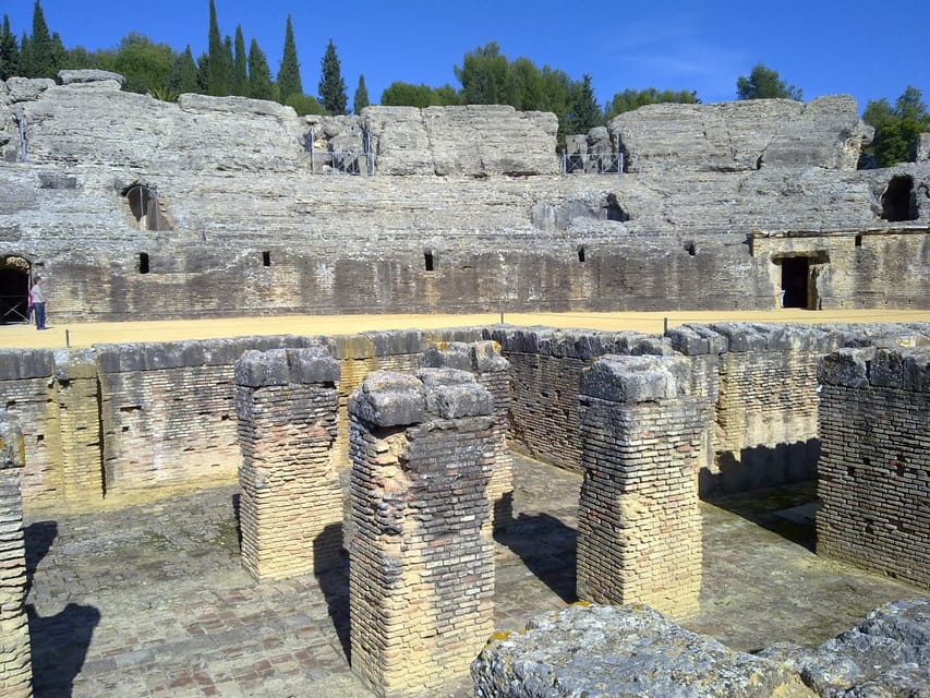 From Seville: Half-Day Guided Bike Trip to Italica - Riding out through Seville and toward Santiponce