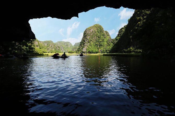 Hoa Lu - Tam Coc - Ninh Binh Day Tour: Biking, Visit Local Family - Rowing beneath Tam Coc’s limestone cliffs