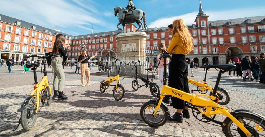 Madrid: Highlights & Parks with Electric Bike Private Tour - Puerta del Sol and Madrid’s alternative neighborhoods