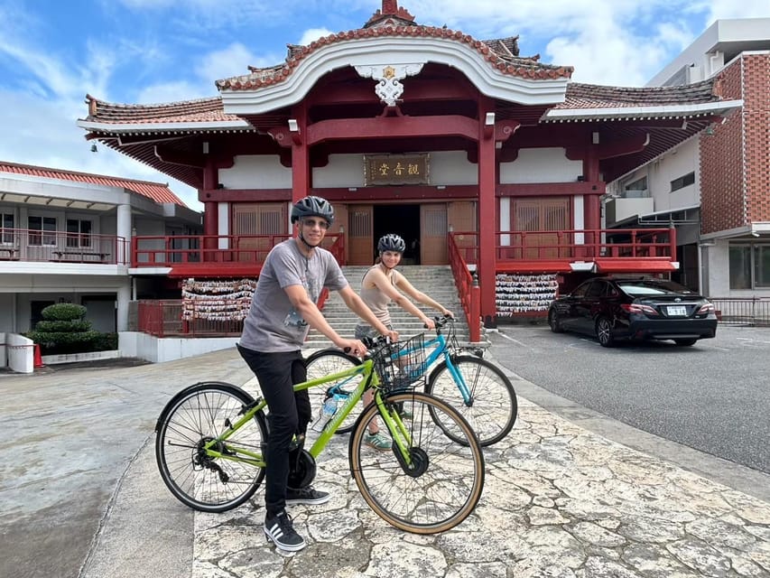 Naha: Guided E-Bike Tour of the 12 Zodiac Temples - Ankokuji Temple and an old tree beside traditional houses