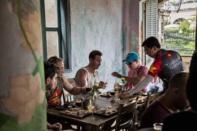 Private Hoi An Evening Food Tastings Tour by Bike - River views, grilled food, and Hoi An after dark