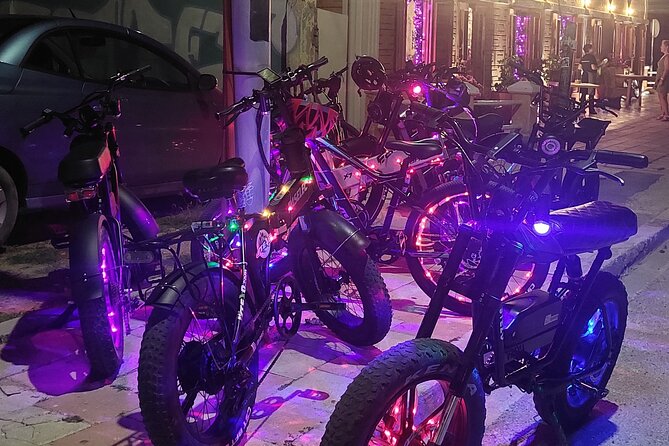 Semi-Private Christmas Edition Twilight Glow E-Bike Oranjestad - Plaza Turismo and the Aruba sign