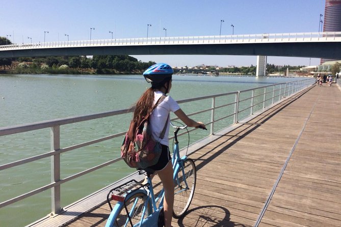 Seville Bike Tour with Full Day Bike Rental - Riding beside the Guadalquivir