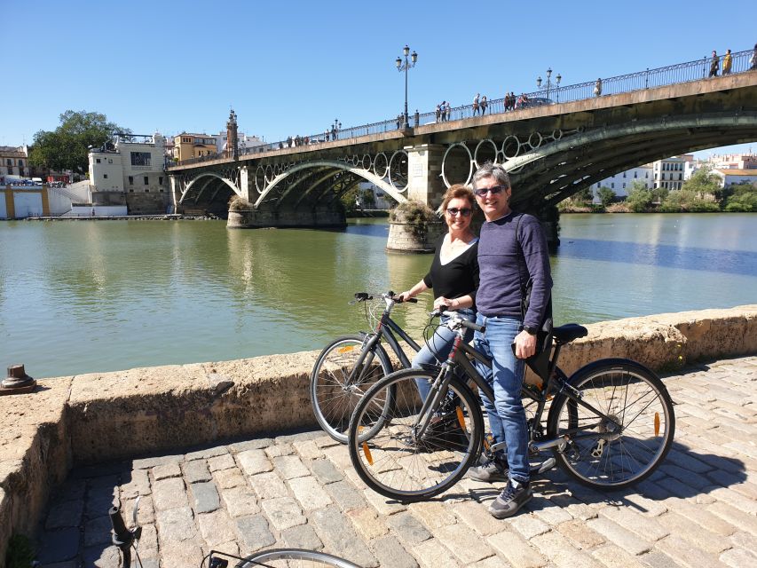 Seville: Highlights Bike Tour with Local Guide - Crossing into Triana