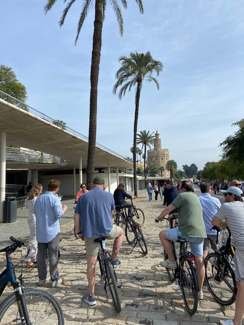 Seville: Highlights City Bike Tour - Crossing to Triana for pottery and flamenco