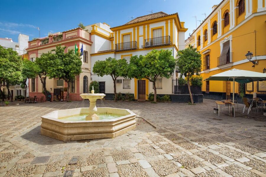 Seville: Relaxing City Bike Tour with a Tour Guide - Rolling beneath the orange trees at Jardines de Murillo