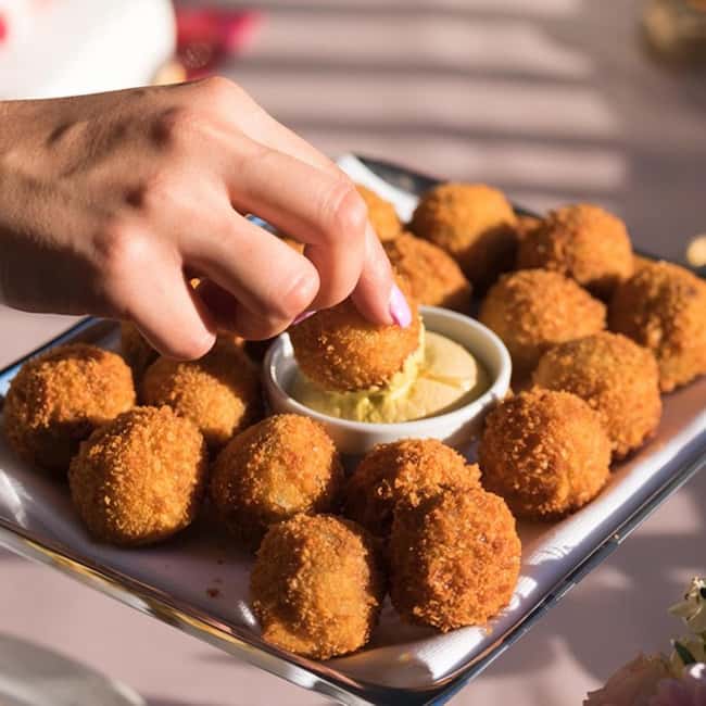 Top 10 Tastings of Amsterdam: Food & Culture Bike Tour - Herring and battered cod bring in the sea