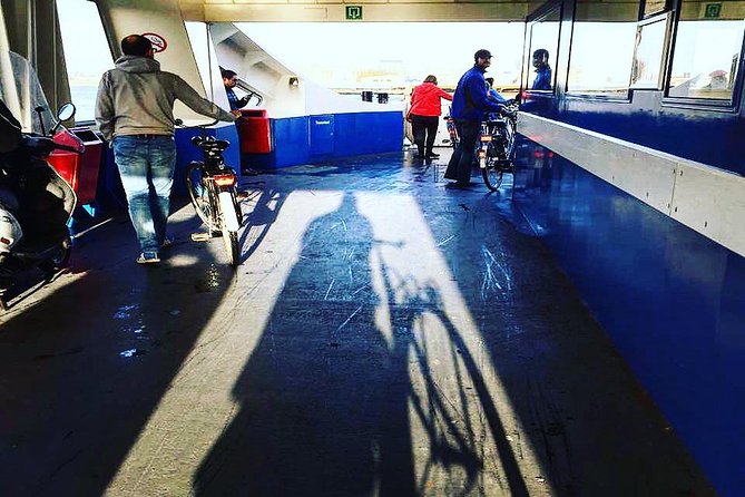 Urban Adventures Amsterdam Bike Tour, Graffiti and Magnet Fishing - The ferry turns the ride into a city adventure